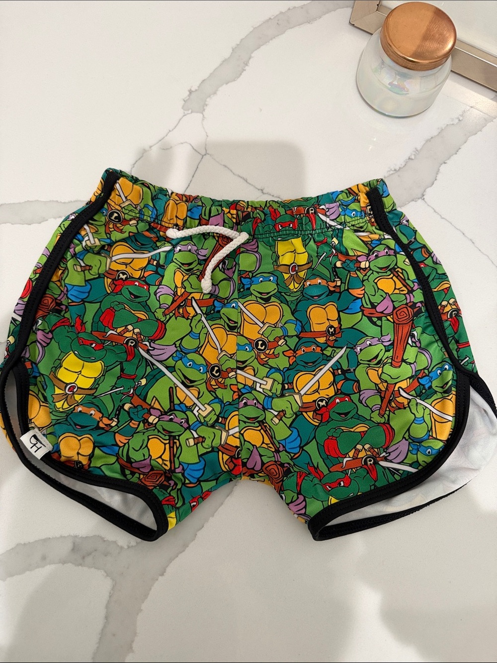 Kids' Green Turtle Print Swim Trunks with Black Trim
